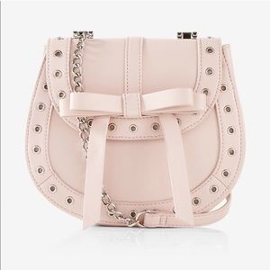 Express Pink Grommet Bow Crossbody Bag